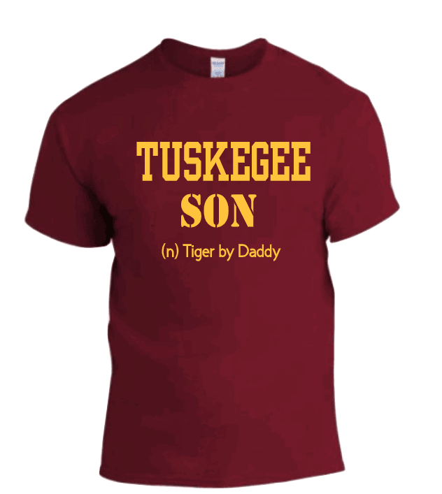 A red T-shirt with 'TUSKEGEE SON' and 'DADDY' printed on the front.