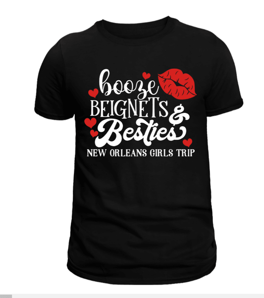 Black t-shirt with the text 'booze, beignets & besties' followed by 'new orleans girls trip' in white letters, and a pair of red lips.