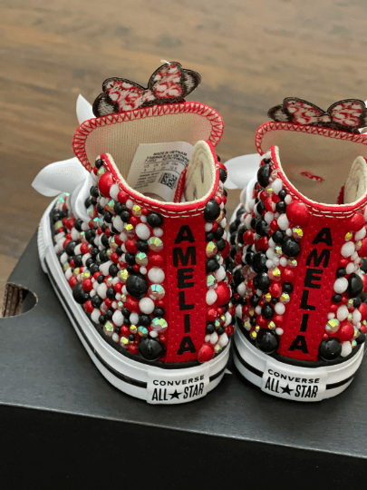 Minnie Mouse Red Bling Converse on top of shoe box with wood background
