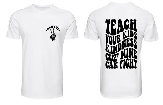 A white crew neck t-shirt with text and a graphic on the front and back. The front shows text 'TEACH YOUR KIDS KINDNESS' with a hand symbol, and the back is blank.