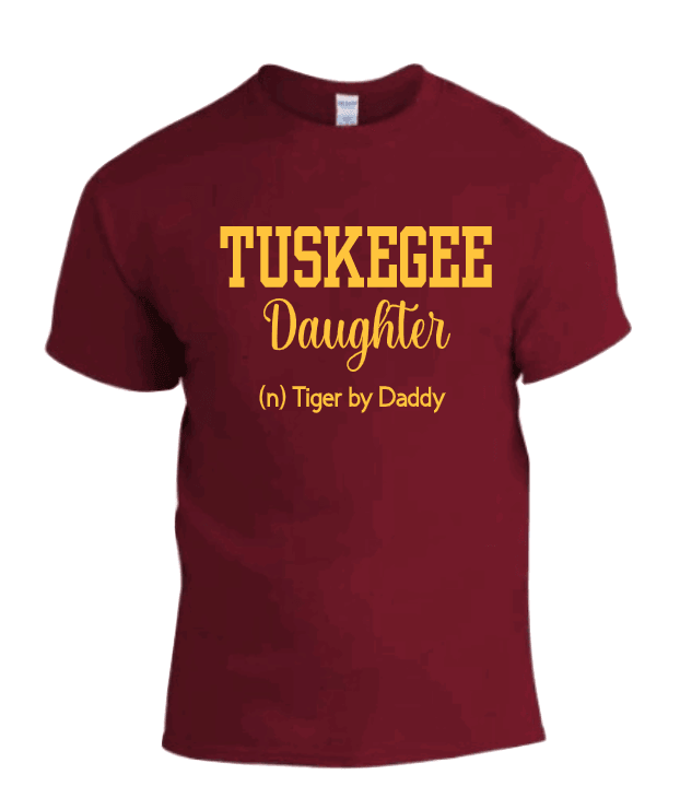 A maroon T-shirt with the text 'TUSKEGEE DAUGHTER' and 'IN TIGER'S CLAW' in a larger font, indicating school spirit for Tuskegee University.