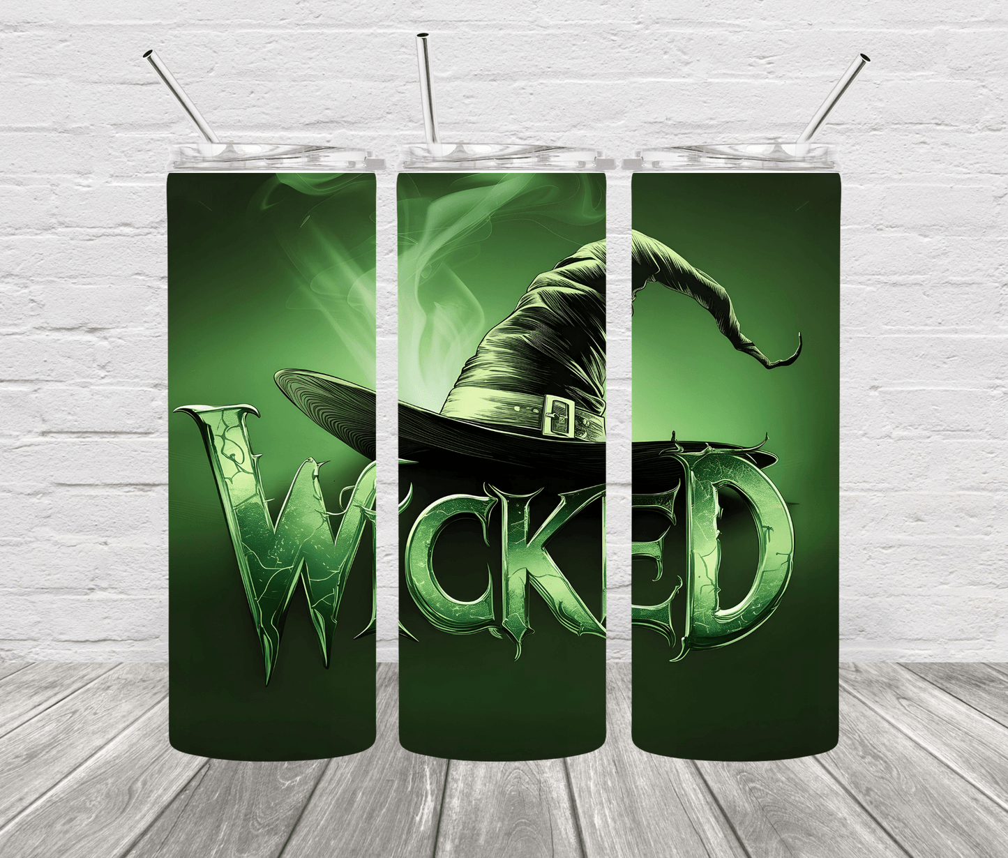 A 20oz stainless steel tumbler with a design featuring the character Elphaba from the musical 'Wicked'. The tumbler is green with a black hat design and the text 'WICKED' prominently displayed.